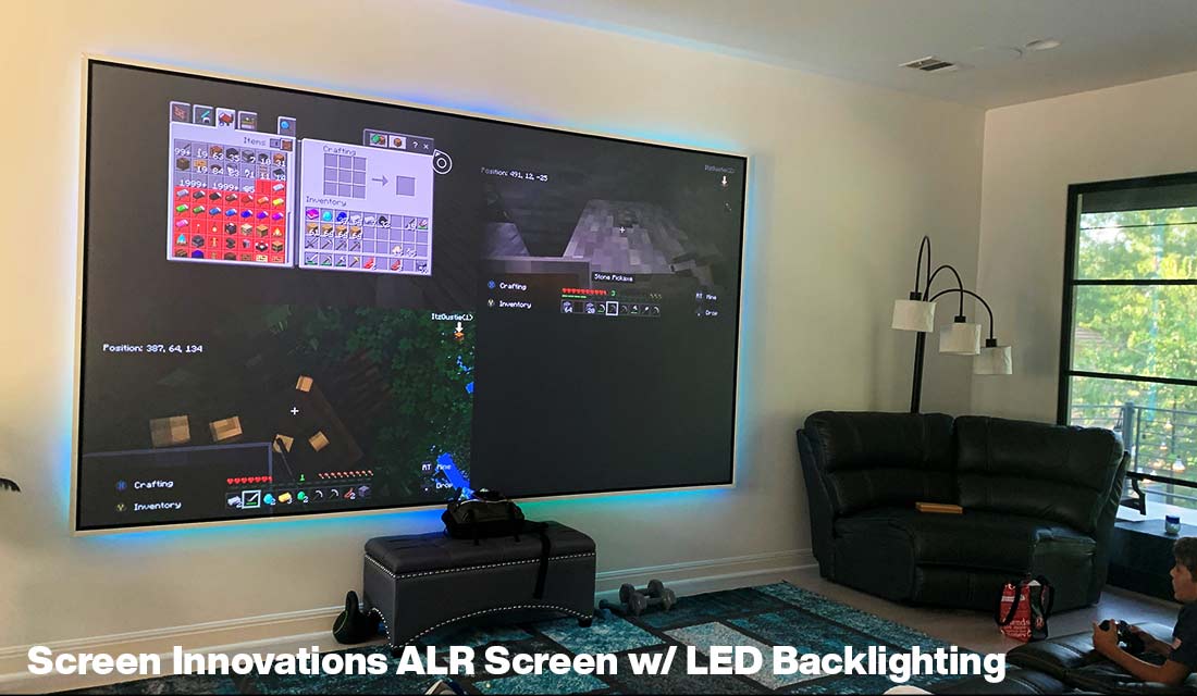 kid playing minecraft on a 120 in. Screen Innovations ambient light rejecting projection screen